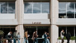 Students walking by the new architecturally designed Latelab building