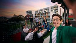 Swinburne student taking a selfie with friends at Hawthorn campus