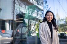 International student Thach Serena faces the camera, smiling.
