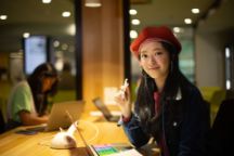 International student Pattar Rungcharoenrod faces the camera, smiling.