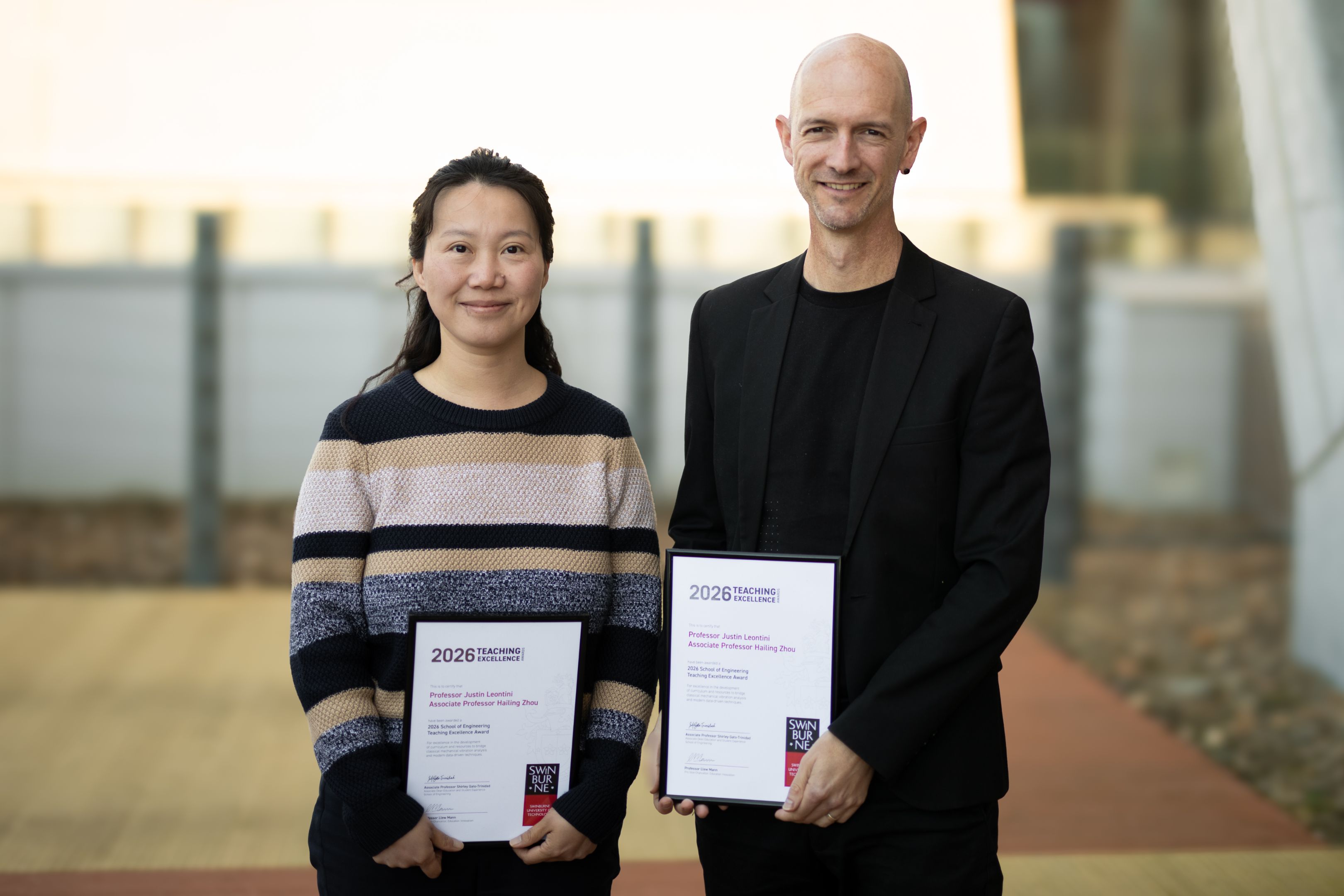 2026 School Teaching Excellence Award recipients Professor Justin Leontini and Associate Professor Hailing Zhou with their certificates