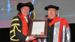 Chancellor John Pollaers and Simon Hammond in academic regalia at August 2022 graduations