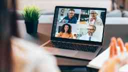 A virtual team meeting on a laptop