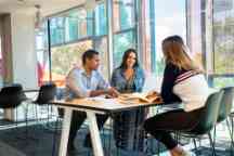 Students sitting at a table in discussion