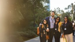 Four international education agents standing out the front of the GS building, on wakefield street.