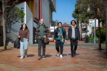 Four students walking on John Street on Swiburne's Hawthorn campus