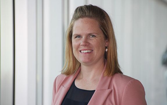 Close up of Bec Grice smiling in pink jacket