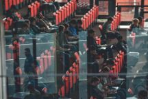 students sitting in ATC lecture theatre chatting and taking notes