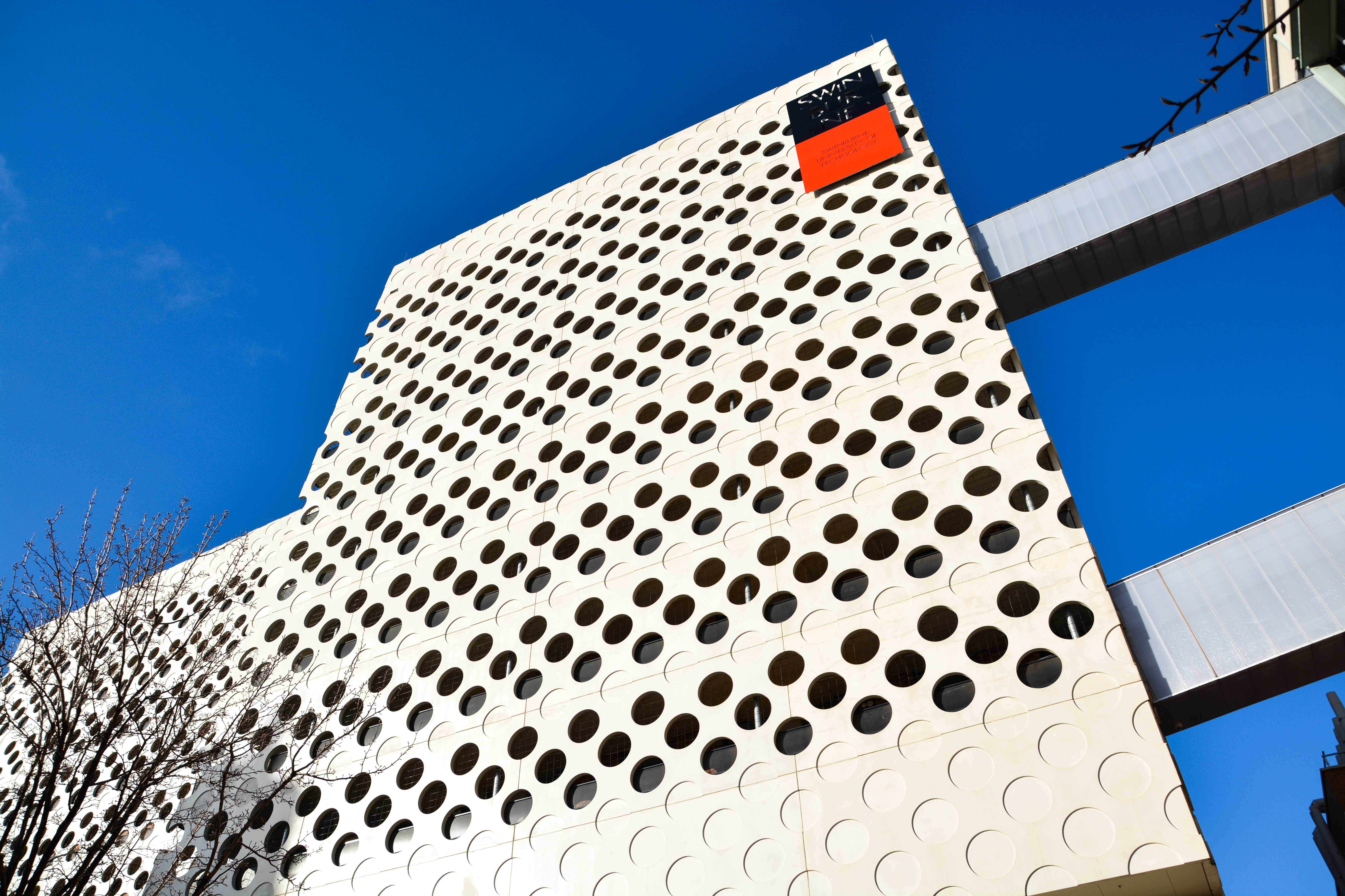 ATC building at Hawthorn in the sun blue sky featuring the Swinburne logo