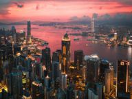 Cityscape of the Victoria Harbour region of Hong Kong during a magical sunset