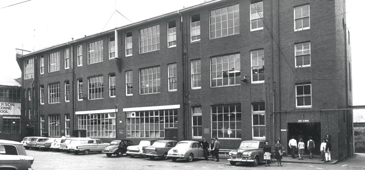 Students and their cars in front of the Art School, 1962.