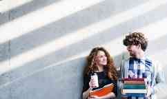 Portrait of young students in a library.