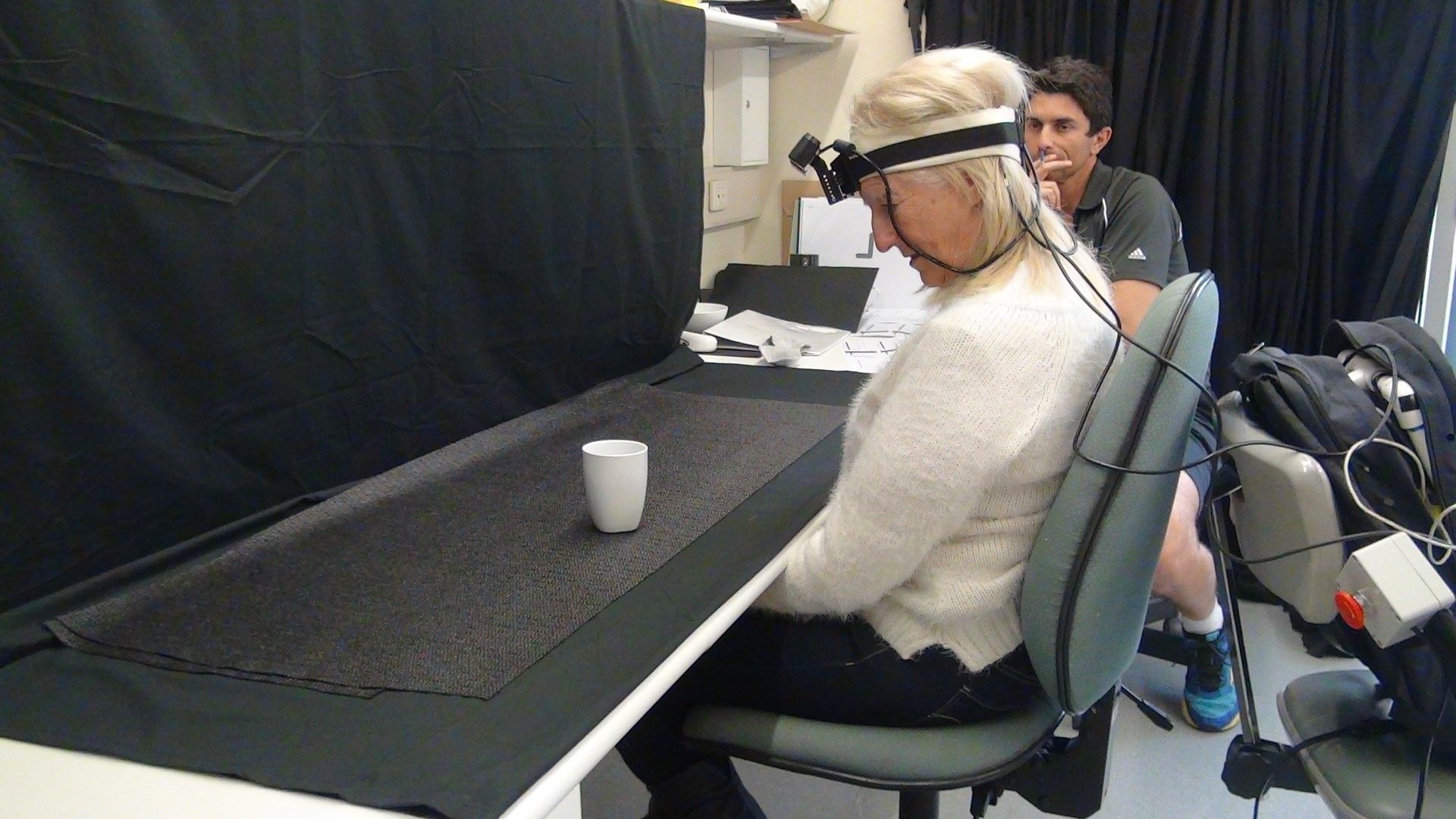 Person wearing vision processing wearable assistive technology.