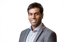 Portrait of a person, smiling slightly.