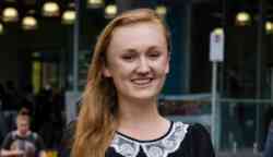 Female student smiling to camera on Swinburne campus