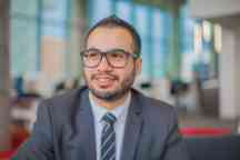 Male graduate working in a professional placement