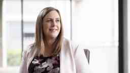 Professional looking woman in blazer.