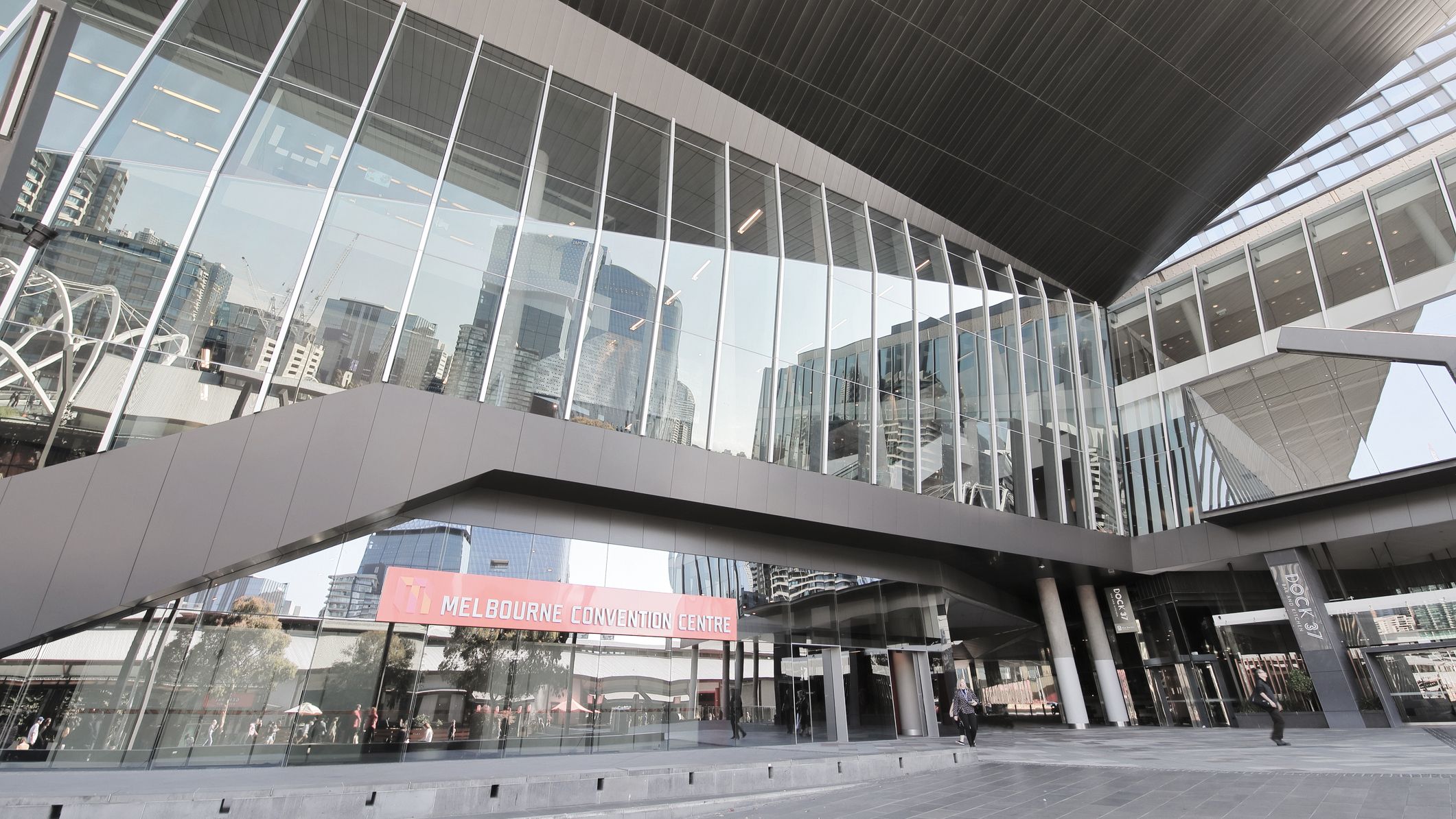 Unidentified people visit Melbourne Convention Exhibition Centre.