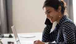Young girl on iphone and laptop