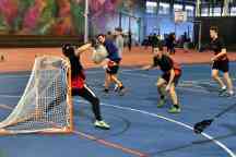 Swinburne Lacrosse team in the middle of a game as the keeping makes a save