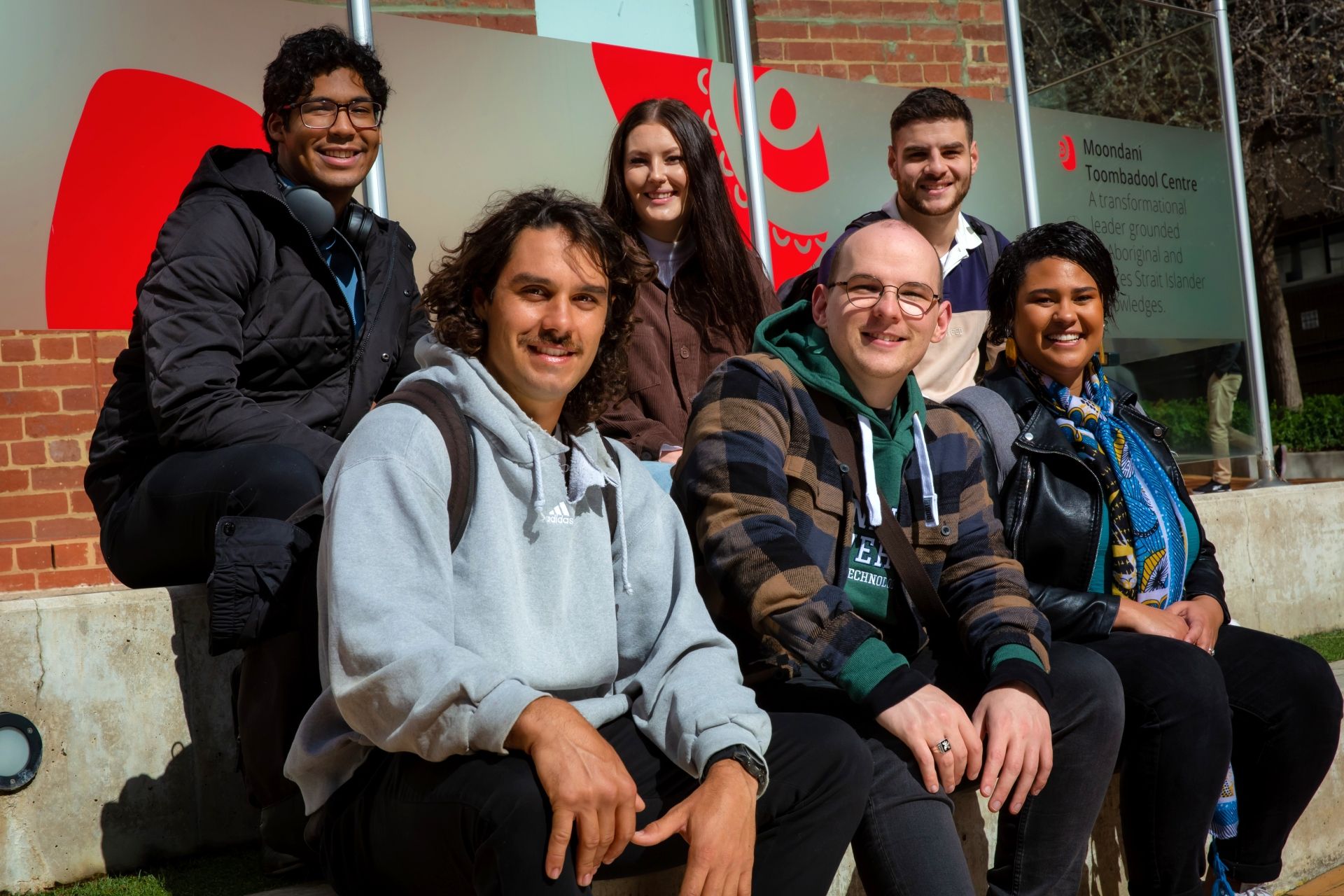 Six students outside of the Moondani Toombadool Centre on Swinburne's Hawthorn campus