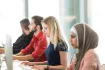 Students working on computers at a computer lab 