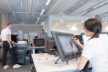 FHAD design student working on a creative brief on a touchscreen monitor