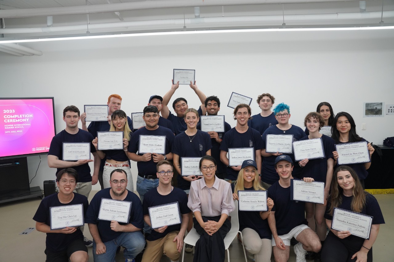 A group of students hold up certificates 